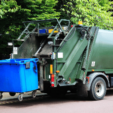 Commercial bin lorry emptying large refuse bin